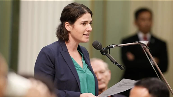 California Assemblywoman Rebecca Bauer-Kahan introduced a bill this year that would mandate coverage for menopause evaluation and treatment options. (Rich Pedroncelli / AP via CNN Newsource) California Assemblywoman Rebecca Bauer-Kahan speaking at a microphone