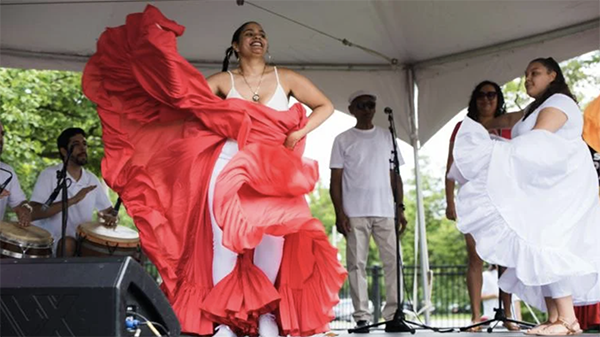 Barrio Arts Festival. (Nomee Photography) A woman dancing with a flowing red skirt