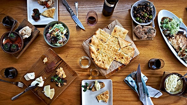 A spread of food and wine on a table