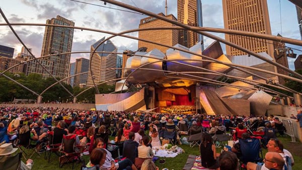 Credit: Patrick Pyszka A crowd watching a performance at Pritzker Pavilion