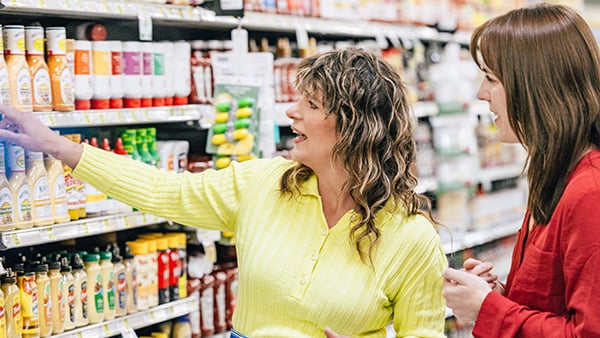 Almost every episode of 'Kitchen Curious with Vivian Howard' features a trip to a grocery store, often with a nutritionist to clear up misinformation. Credit: Provided Vivian Howard stands next to a woman in a grocery store aisle and points at a shelf
