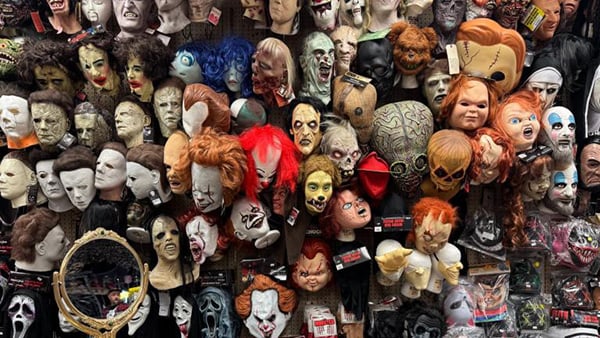 Credit: Nicole Cardos for WTTW News A wall displaying dozens of Halloween masks