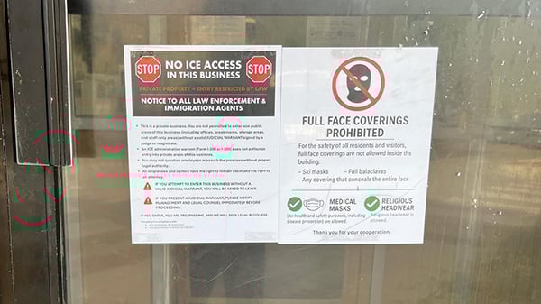 Restaurants and other businesses in Chicago have posted signs barring the entrance of federal immigration agents. Credit: Daniel Hautzinger for WTTW Two pieces of paper on a door forbidding the entrance of federal immigration agents