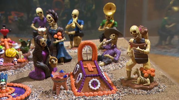 Credit: WTTW News Skeleton figures as part of a Día de los Muertos display
