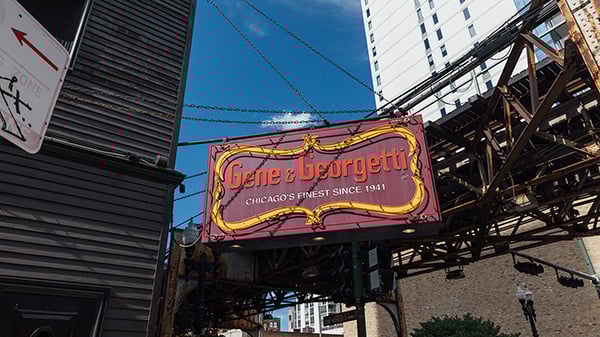 Gene & Georgetti will receive the first Iconic Restaurant of the Year recognition at Chicago's local Banchet Awards in 2026. Credit: Sandy Noto for WTTW The Gene and Georgetti sign outside the restaurant in front of El tracks