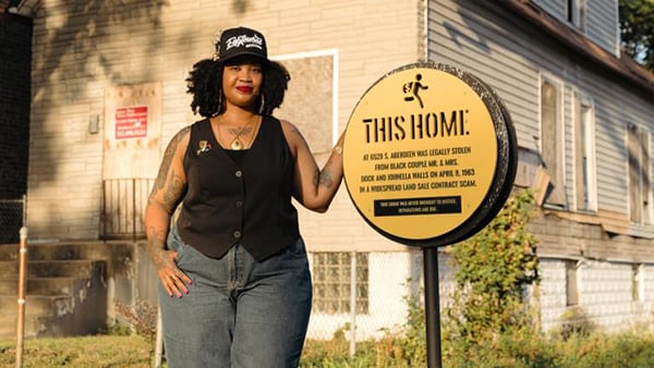 Credit: Tonika Lewis Johnson Tonika Lewis Johnson poses in front of a house in Englewood