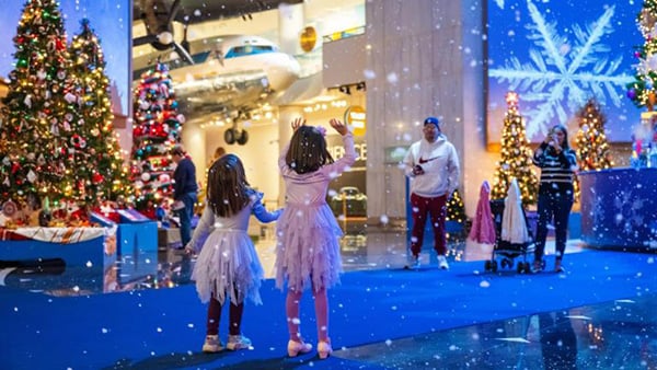 Children explore the Christmas Around the World exhibit at the Museum of Science and Industry
