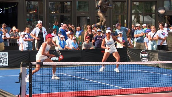 Two women playing in a pickleball tournament