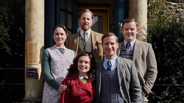 Mrs. Hall, Siegfried, Tristan, James, and Helen all pose in front of Skeldale Hall