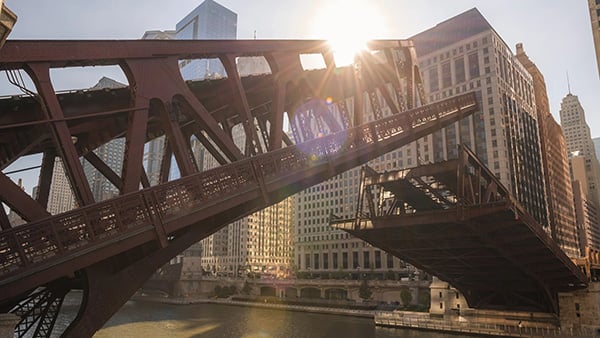 A metal bridge over a river raising by splitting in two