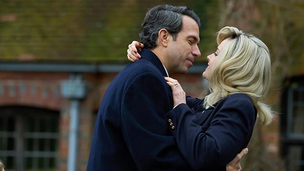 John dips Marnie for a kiss outside a house 