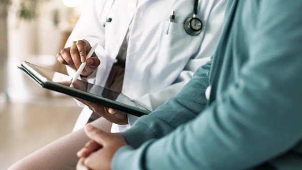 A stock image of a doctor with a patient
