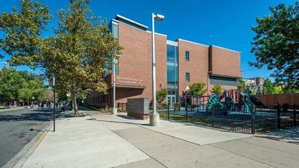 Edison Elementary Regional Gifted Center, with a playground in the foreground, is pictured on a sunny clear day.