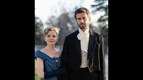 Eliza and Alexander pose next to each other outside