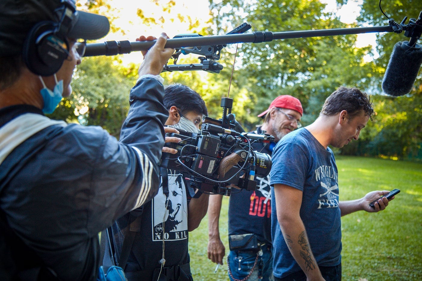 Behind the scenes filming FIRSTHAND subject with camera person and sound engineer