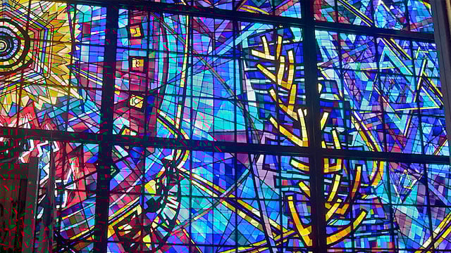 The stained glass façade of the Chicago Loop Synagogue, seen from the interior. Photo credit: Alan Brunettin