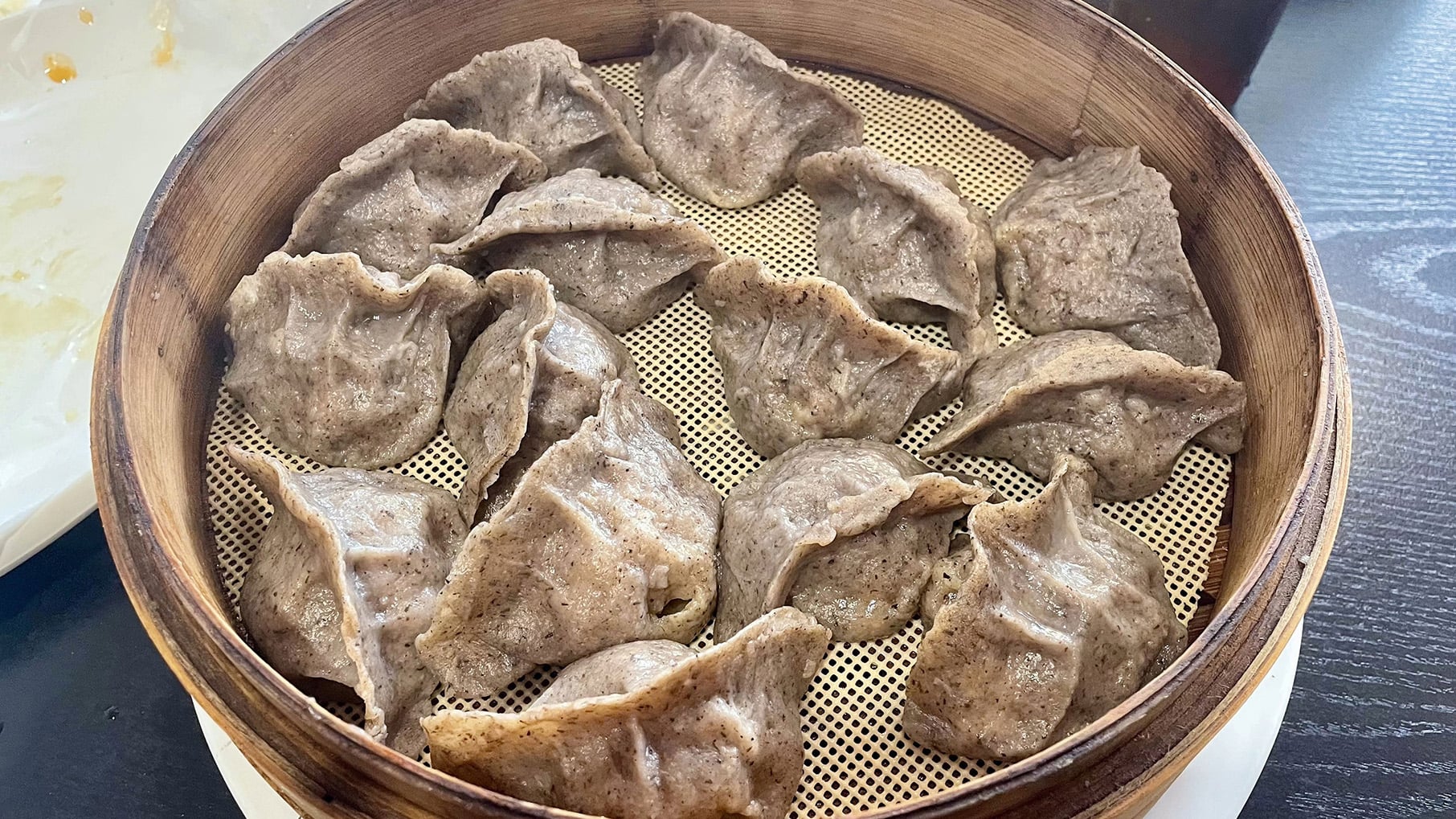 Buckwheat dumplings in a bamboo steamer