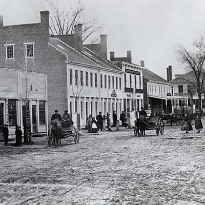 Downtown Concord, Massachusetts, pictured circa 1860-1865. The Parkman House, where the Thoreau family lived for a time, is the right-most visible house in the background. Credit: Concord Free Public Library