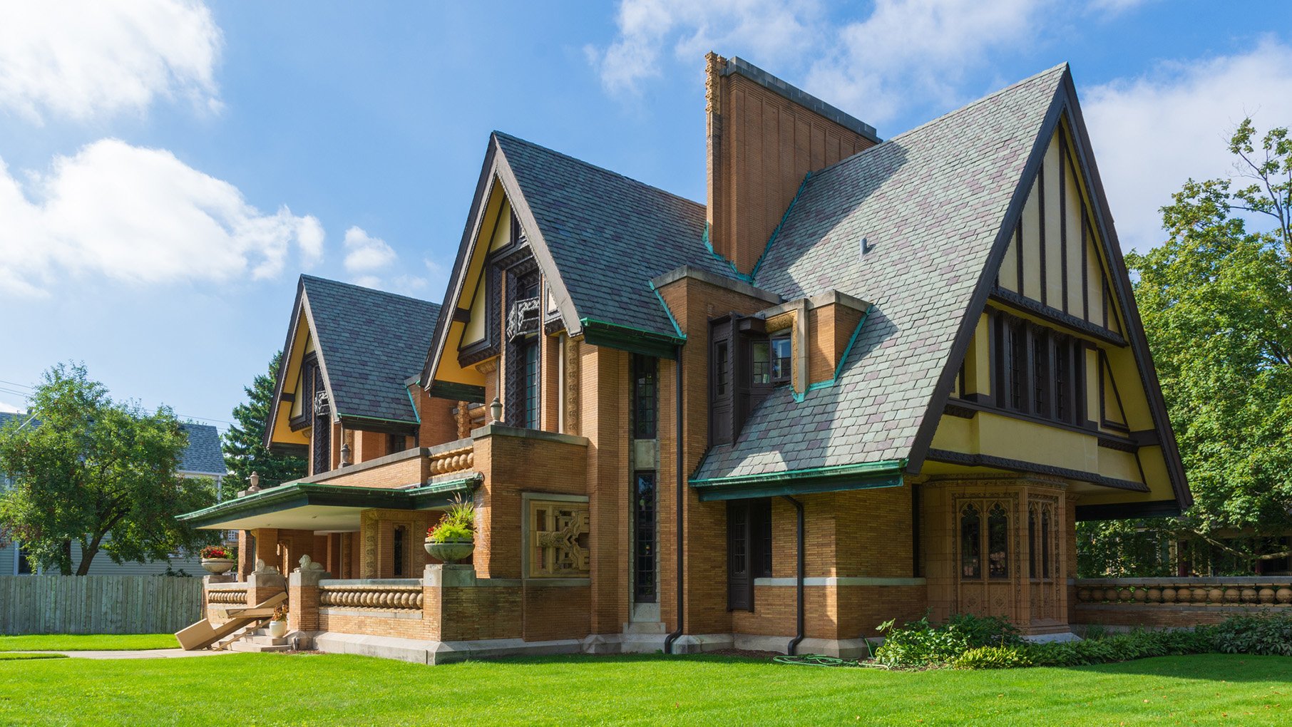 A Frank Lloyd Wright-designed house against a blue sky