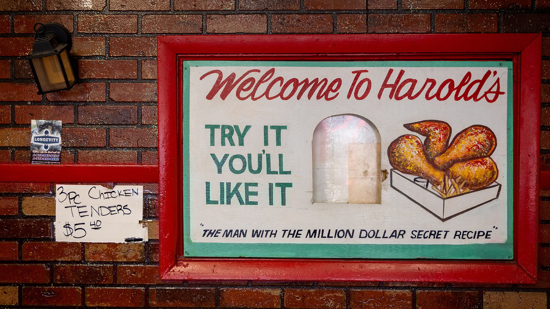 Signage in Harold's that says 'Try it you'll like it'