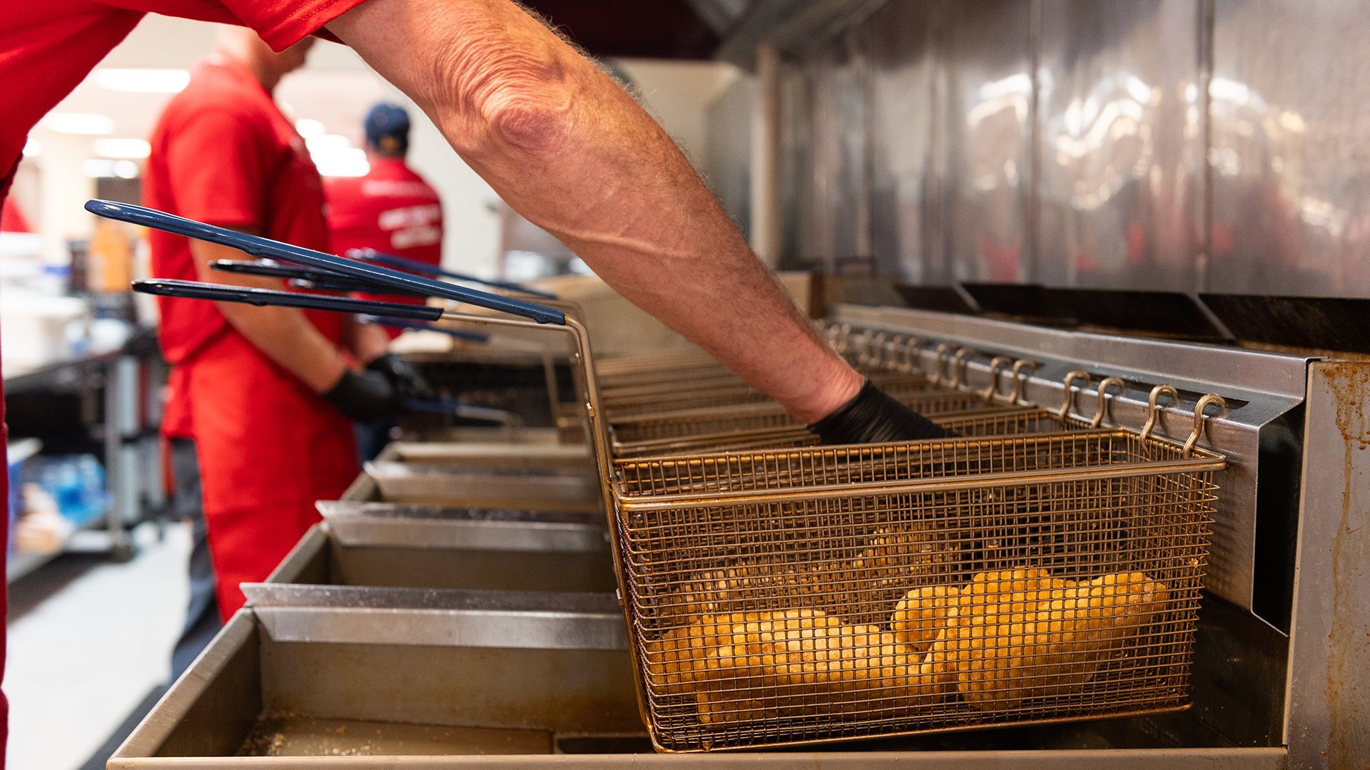 Fish fries in a basket ready to go in the fryer