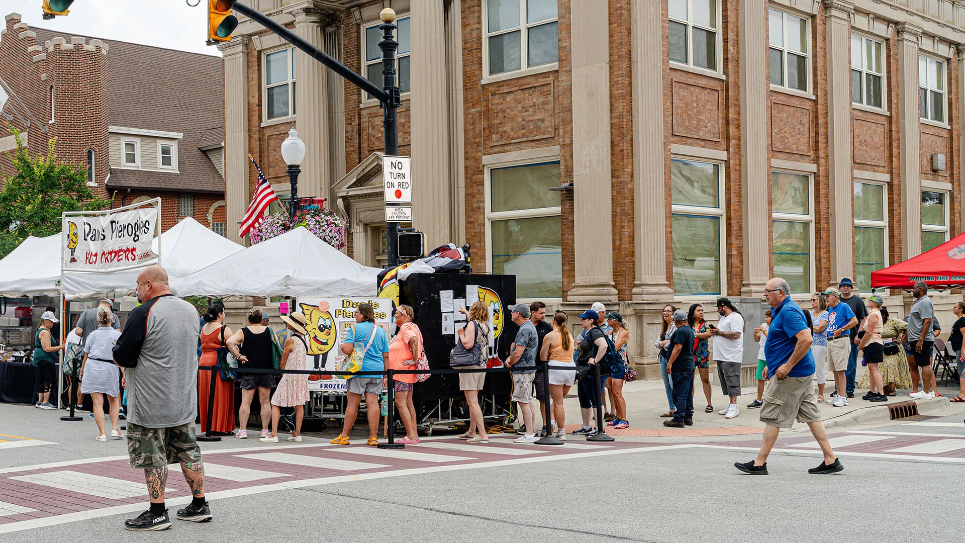 A long line of people wait to order their pierogi