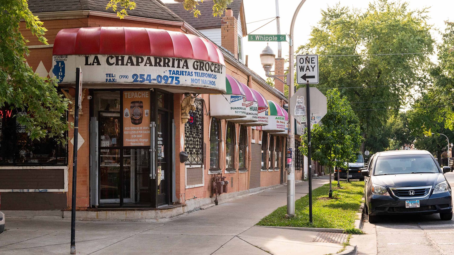 The exterior of a corner grocery store and taqueria called La Chaparrita