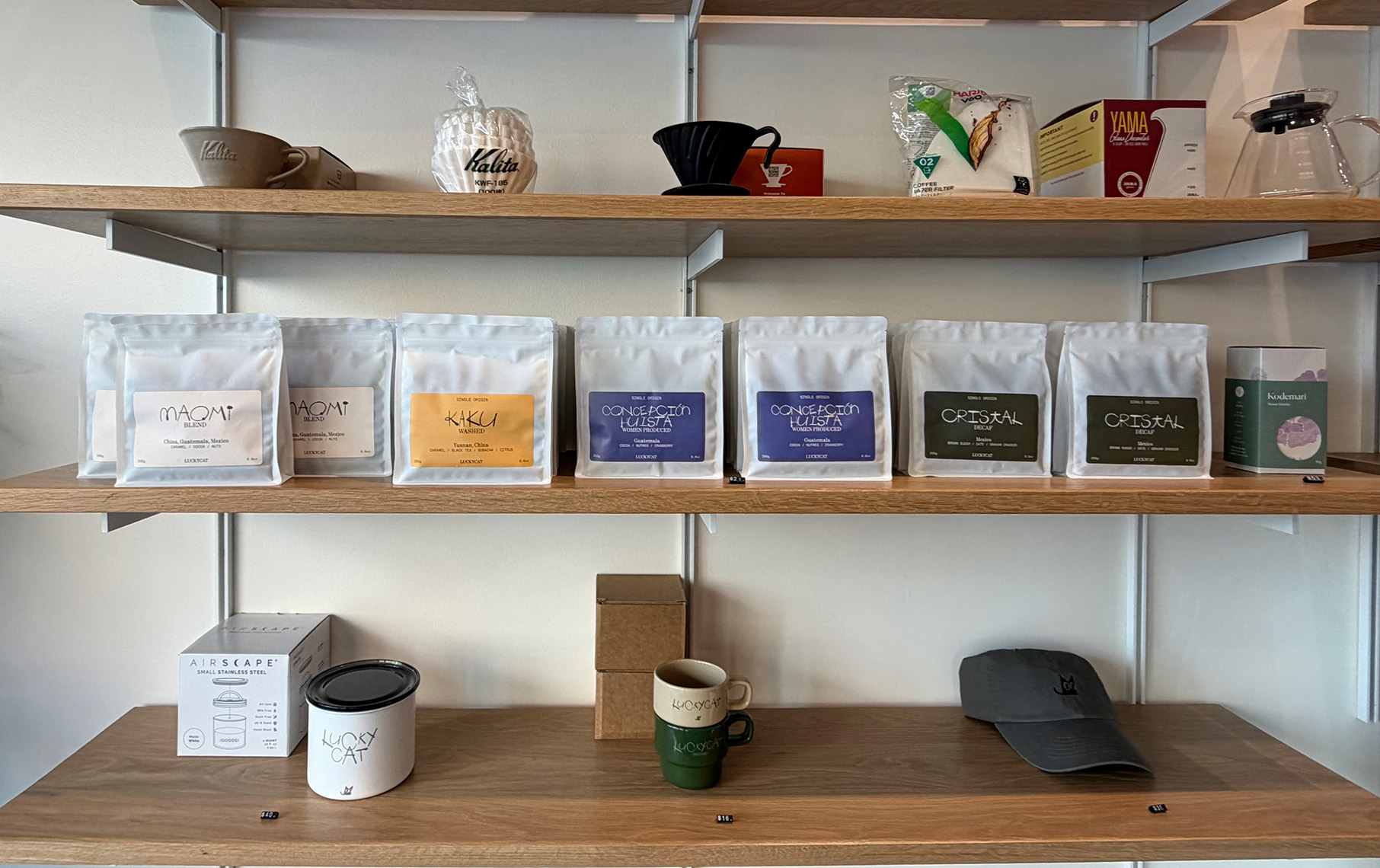 Shelves with bags of coffee on them