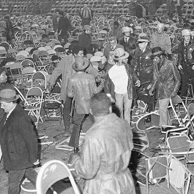 After technical difficulties airing the Muhammad Ali and Joe Frazier heavyweight championship fight on March 8, 1971 on closed-circuit TV at the Coliseum, Chicago, Illinois, a disturbance broke out. Photo: ST-40000976-0006, Chicago Sun-Times collection, Chicago History Museum