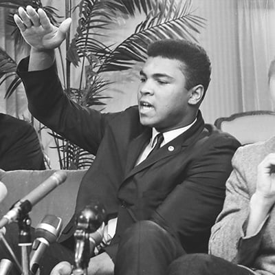 Boxing Heavyweight champion Muhammad Ali holds a press conference on January 8, 1966 at the Continental Plaza Hotel, located at 909 North Michigan Avenue, Chicago, Illinois, where he announced that his next fight would be against Ernie Terrell in Chicago. Photo: ST-50000283-0003, Chicago Sun-Times collection, Chicago History Museum