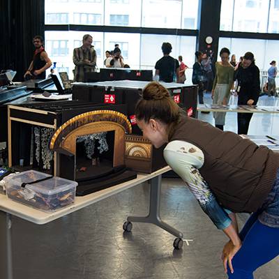 April Daly looking at a model of the set (Photo by Chloe Hamilton)