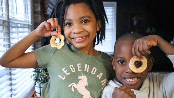 Kids displaying their Heart Apple Chips. Kids displaying their Heart Apple Chips.