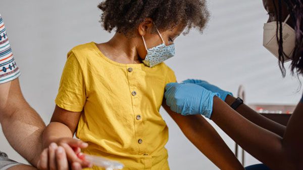 Child receiving a vaccine Child receiving a vaccine