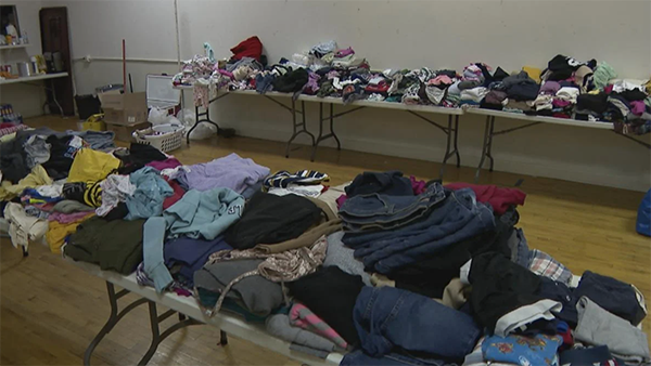 (WTTW News) Donated clothes sitting on tables