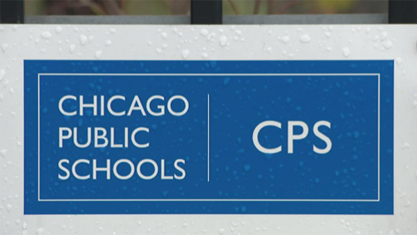 (WTTW News) A Chicago Public Schools logo sign covered in rain drops.