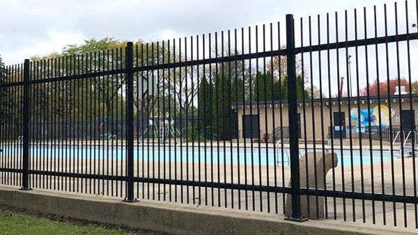 A public Chicago pool as seen through a fence