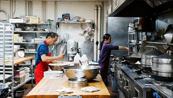 Bakers working in a prep area of Chiu Quon Bakery in Chinatown