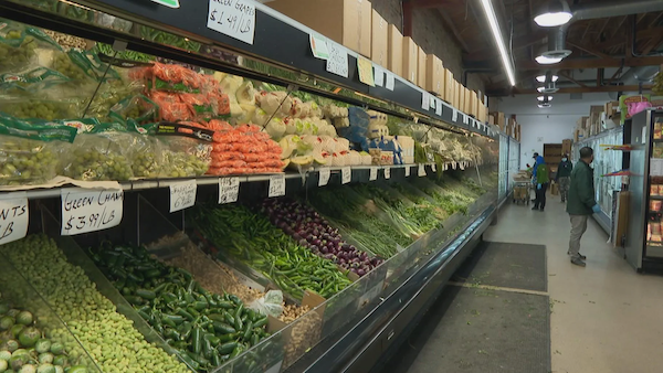 A grocery store aisle with produce