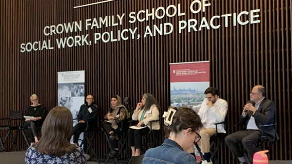 Sima Quraishi, executive director of Muslim Women’s Resource Center, third from left, speaks about her experience assisting Afghan evacuees during a discussion held at the University of Chicago’s Crown Family School of Social Work, Policy, and Practice on April 17, 2024. (Eunice Alpasan / WTTW News)