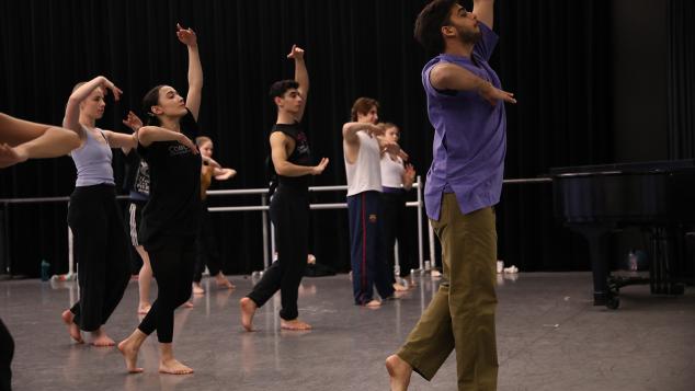 Mehta teaching choreography to dancers.