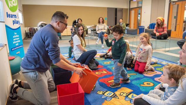 WTTW Kids Learn & Play host Cristian engages with a child at a Kids Learn & Play event.