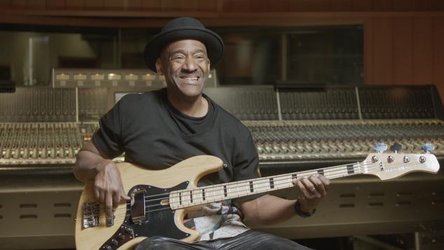 Songwriter and producer Marcus Miller holding an electric guitar