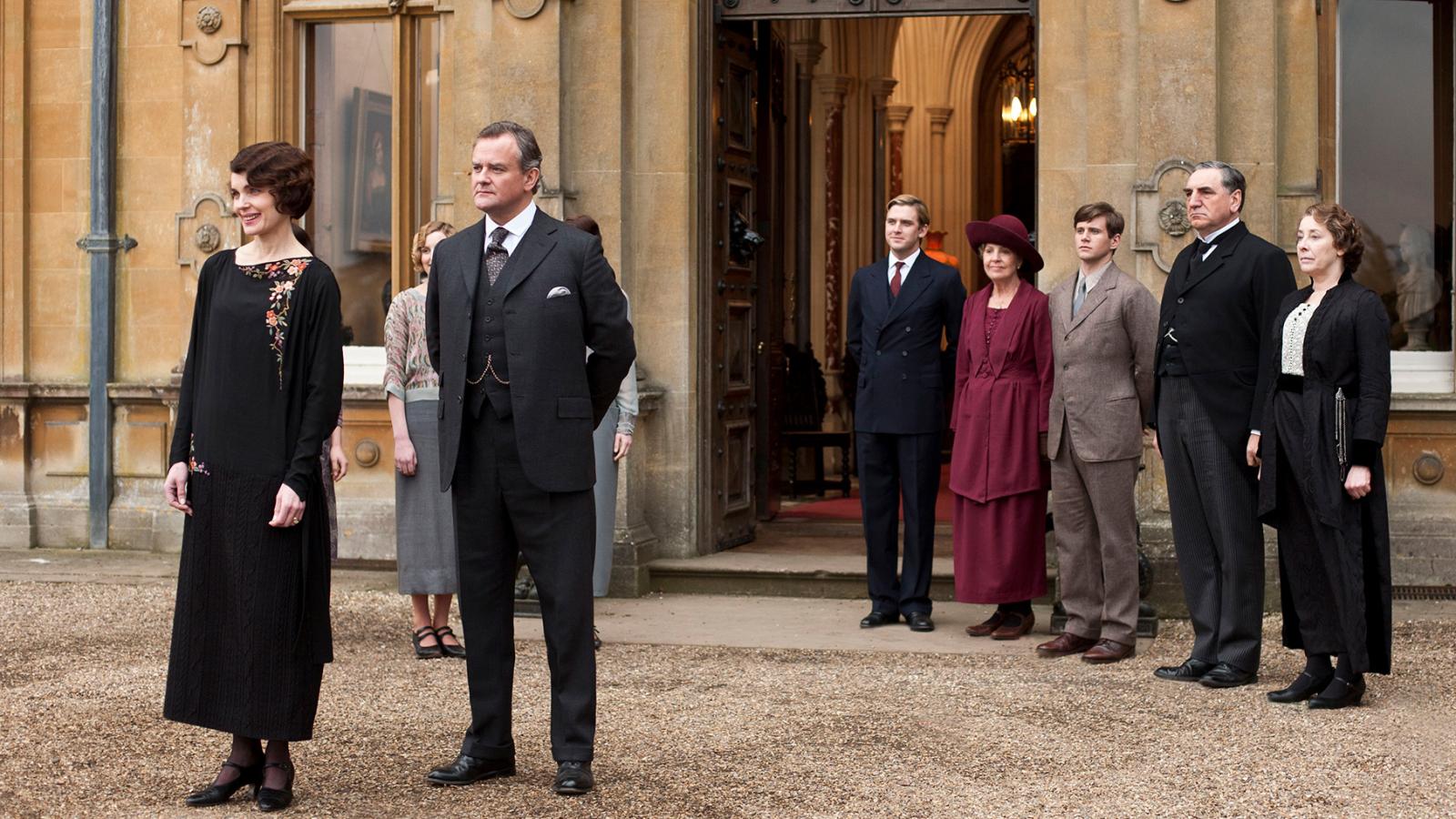 People stand outside of Downton Abbey 