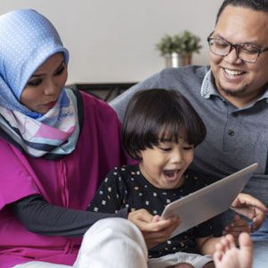 Parents playing game with toddler