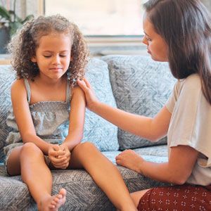 Mom comforting child. Mom comforting child.