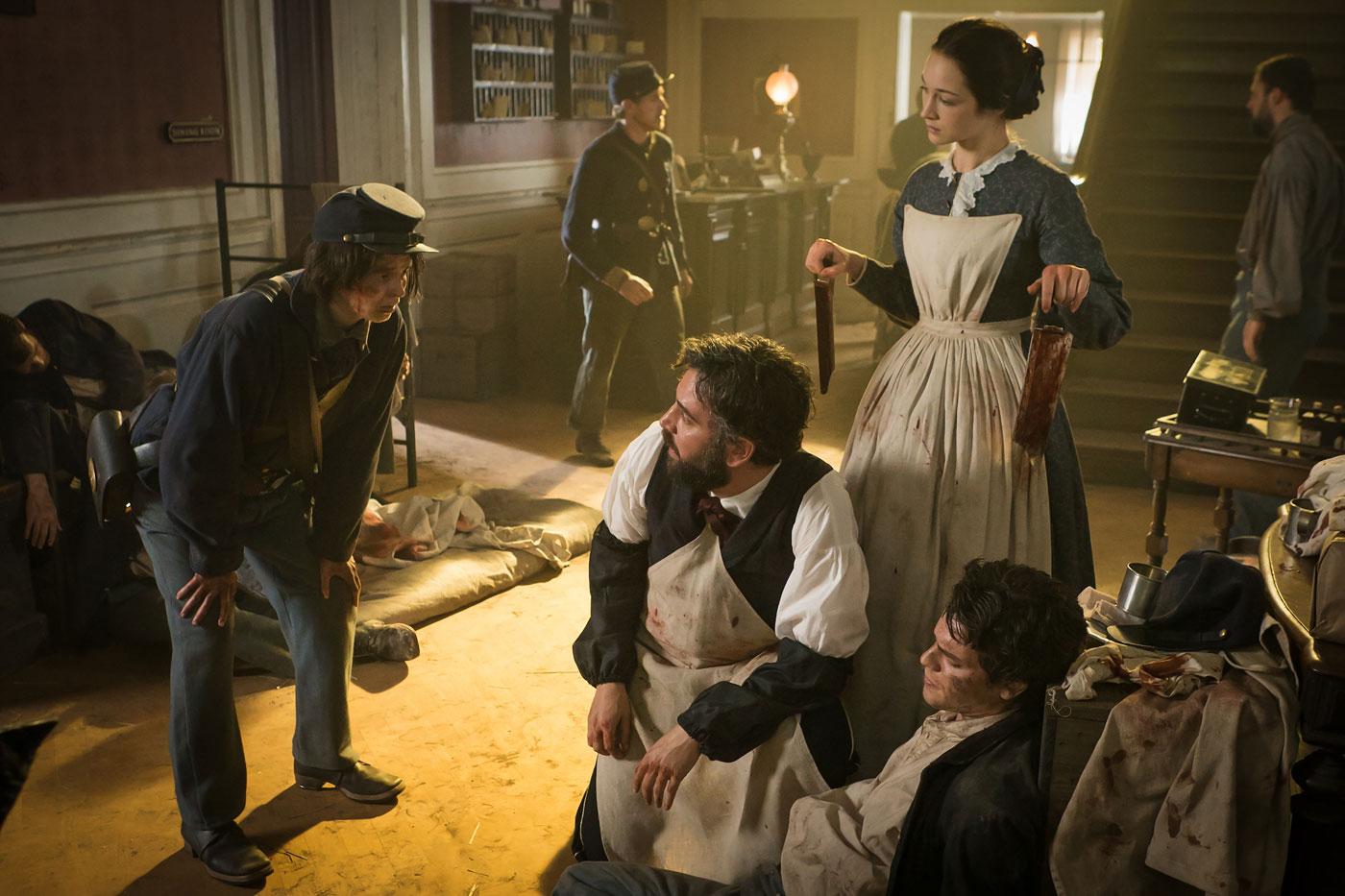 A young soldier has arrived with a wounded friend, and pleads for someone to save the rest of the soldiers on a battlefield. (Courtesy of PBS/Erik Heinila)