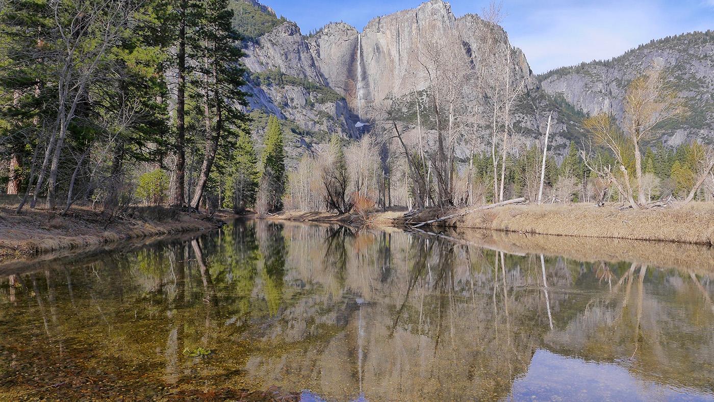 Yosemite Falls, the tallest waterfall in North America, in the background of Yosemite Valley's Merced River. (Courtesy of Nimmida Pontecorvo/© THIRTEEN Productions LLC)