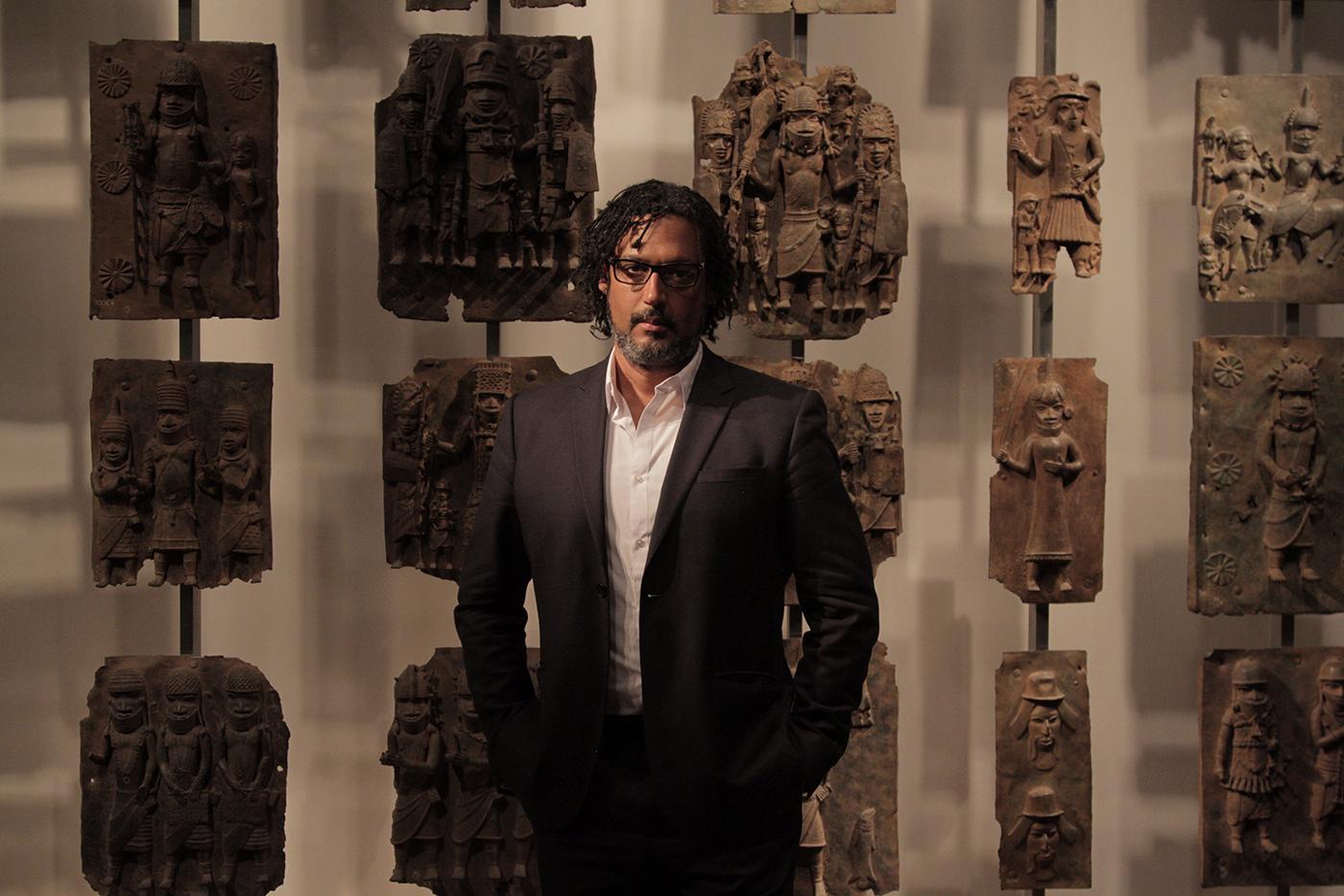 Presenter David Olusoga with various Benin Bronzes, Unknown Artist (c. 1550 – 1650) – British Museum, London. Photo: Nutopia Ltd
