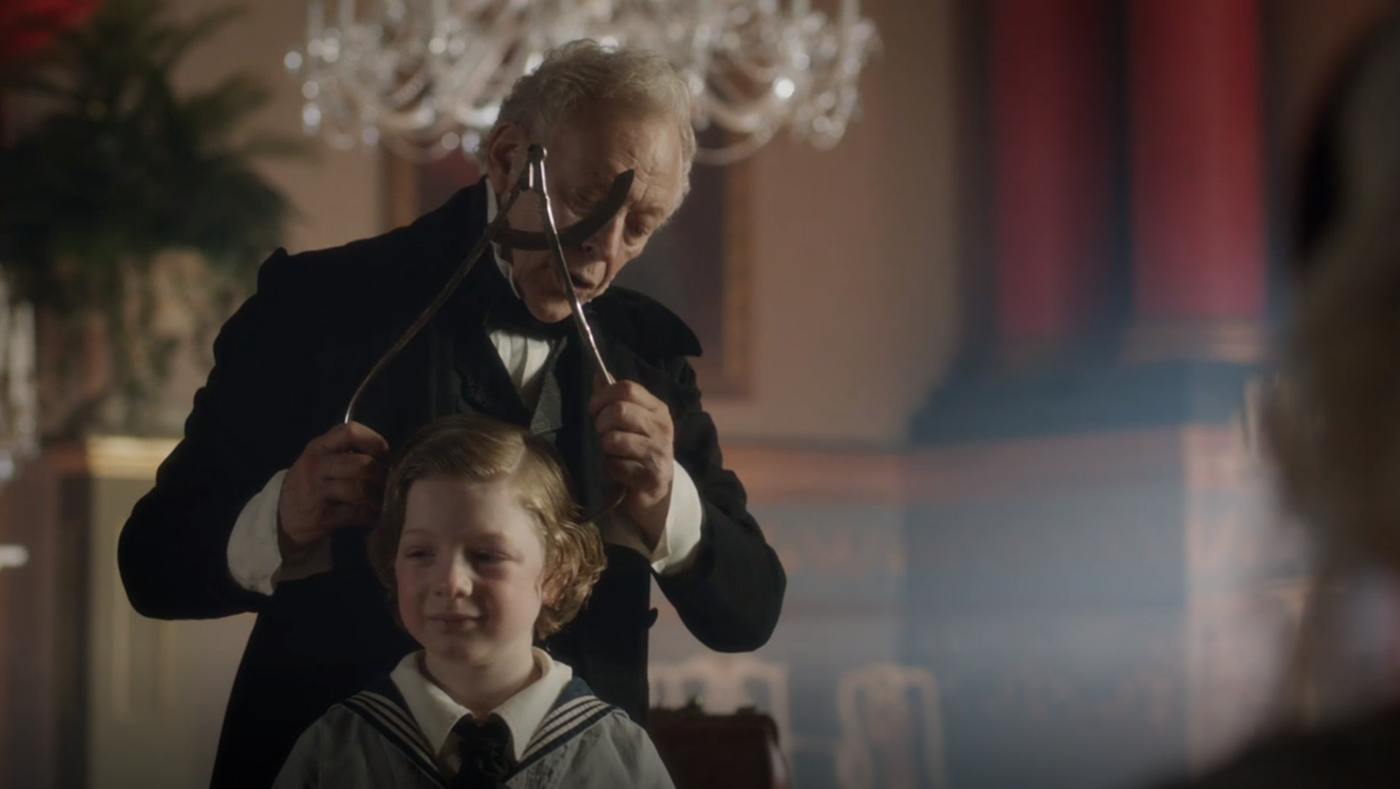 A phrenologist examines Bertie's skull in Victoria