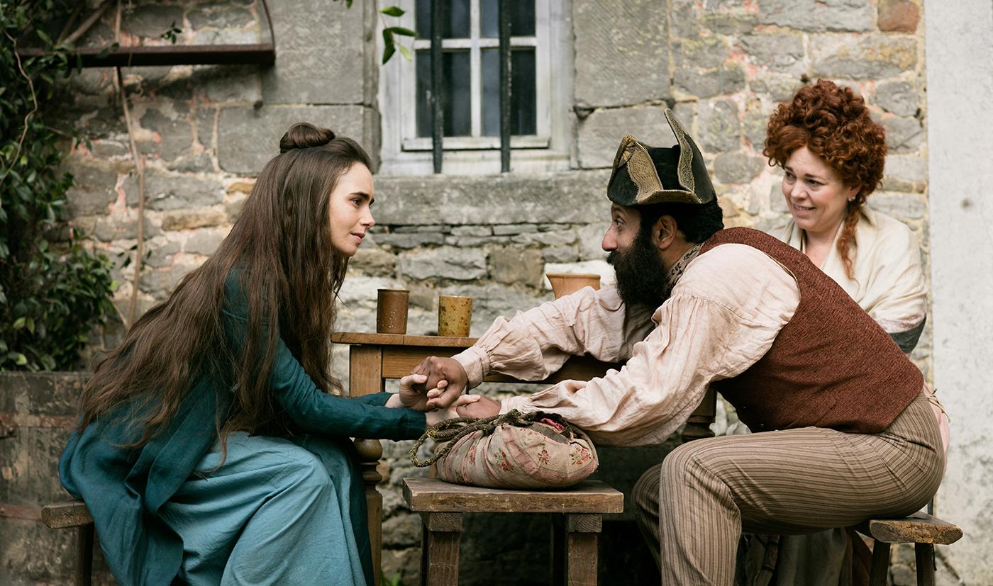 Fantine (Lily Collins), Thernardier (Adeel Akhtar), Madame Thenardier (Olivia Colman) in Les Miserables. Photo: Robert Viglasky / Lookout Point